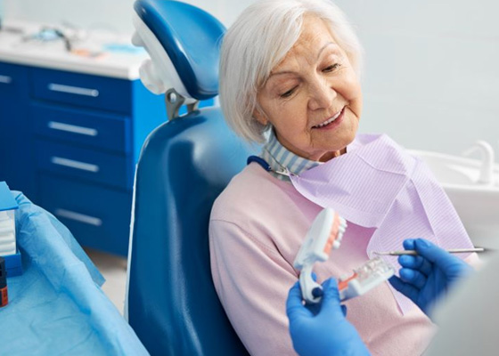 Dentist and patient discussing dental implants