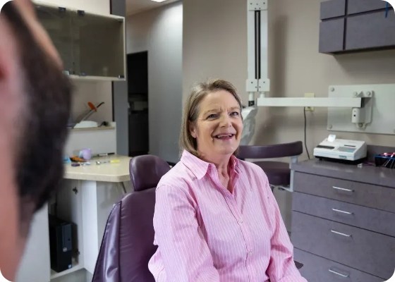 Senior woman smiling in dental chair