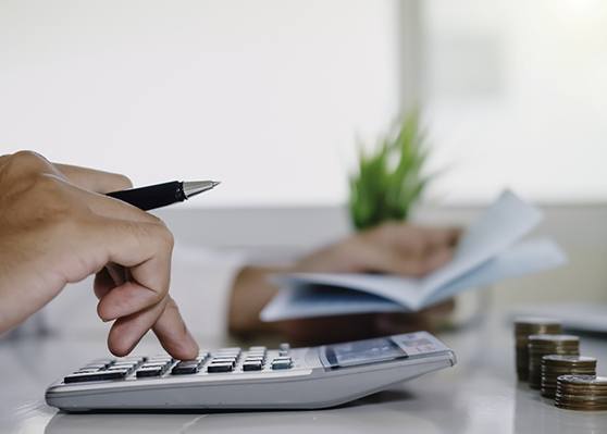 Man using a calculator