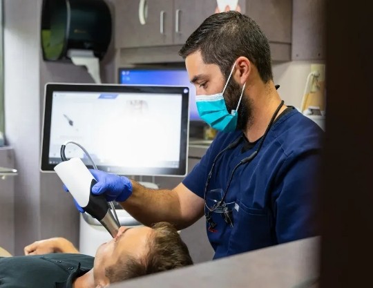 Dentist scanning a patients teeth